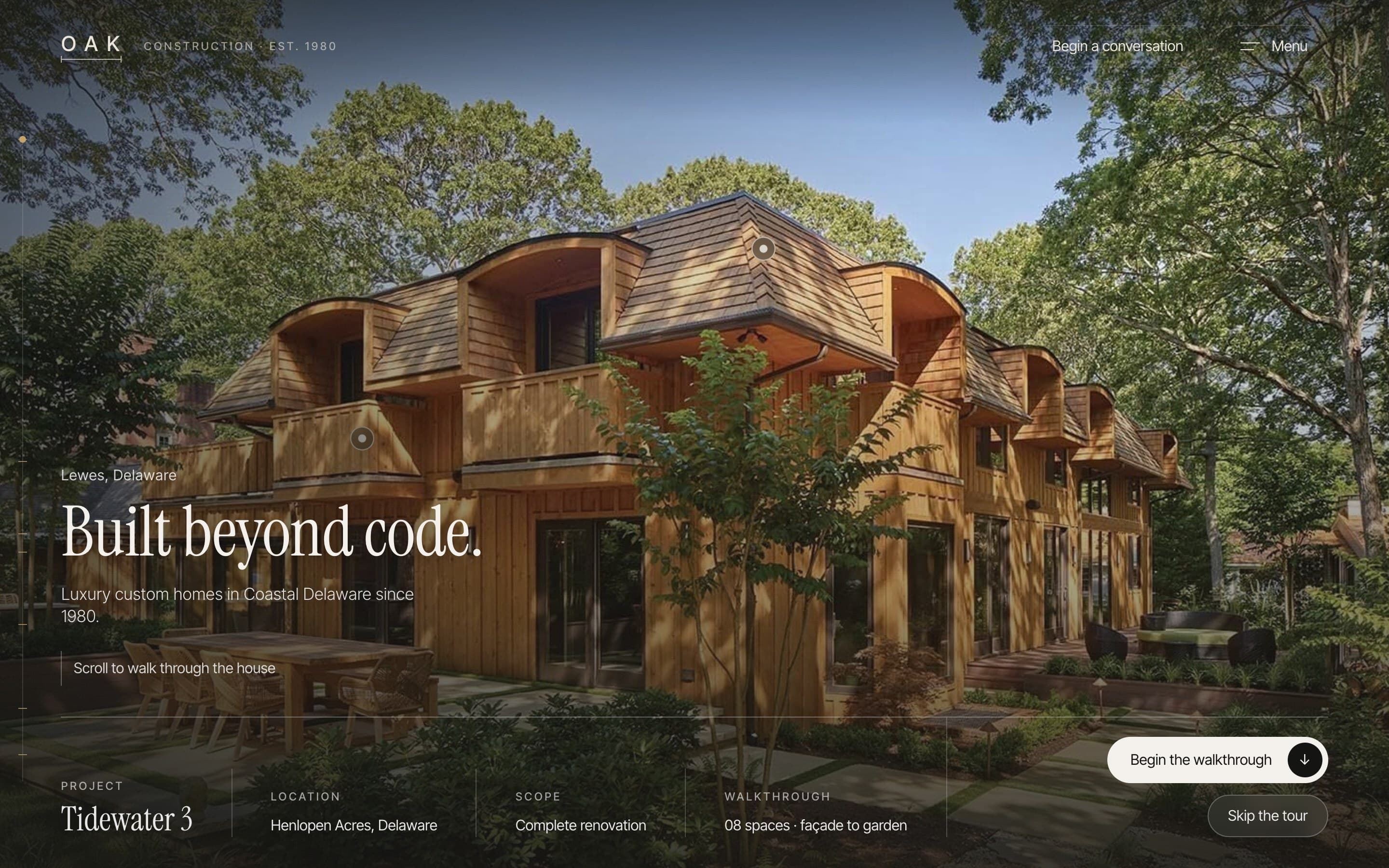 The opening of the walkthrough: a cedar-clad home in the trees, titled “Built beyond code.”